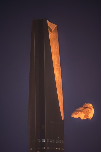 Moon in Clouds looks beautiful besidw kingdom tower