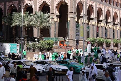 Mecca, Saudi Arabia - March 12 2025: people buying products from market shop in Mecca close to Masjid al-Haram, pilgrims umrah shopping in Makkah