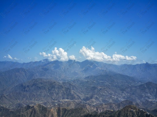 A snapshot of a series of mountains and green areas in Fifa, southern Saudi Arabia, houses on mountain heights, nature in Saudi Arabia