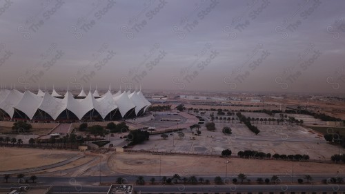 King Fahd International Stadium in the capital, Riyadh, and the sky appears almost clear during the sunrise