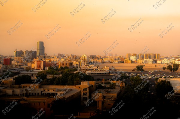 View of Jeddah city in Saudi Arabia at sunset, showcasing a mix of modern and traditional buildings under a twilight sky.