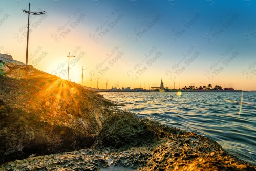 Aesthetic picture of Al-Khobar waterfront during sunset, calm seascapes, marine nature.