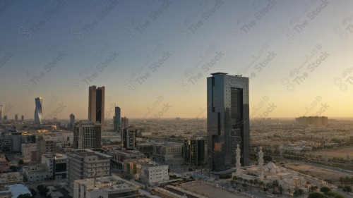 An aerial photo of the capital, Riyadh, and it shows the sky is almost clear during the day, the towers in the city of Riyadh