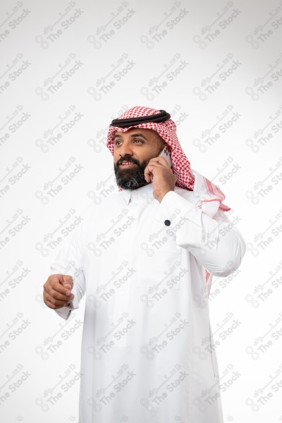 Portrait of a Saudi man holding a phone and making a phone call with different expressions