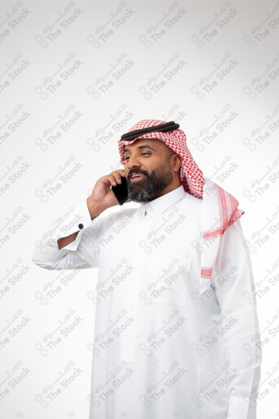 Portrait of a Saudi man holding a phone and making a phone call with different expressions