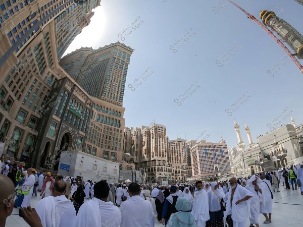 The city of Mecca with pilgrims around the Grand Mosque and the Clock Towers in the background.