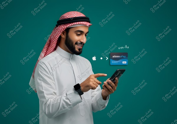 A portrait of a man wearing traditional Saudi attire with a red checkered shemagh, using a mobile phone. A black smartwatch is visible on his wrist. In the background, icons indicate mobile payments, including the Apple logo and a payment card labeled \"alinnaaPay\". The background is dark blue.