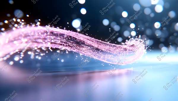 An abstract image of glowing pink light trails stretching across a blurred background with blue and white tones. Small light particles appear to be floating around the shimmering trails.