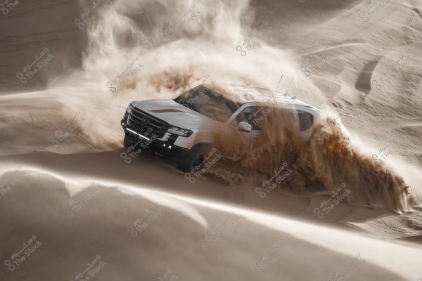 A white SUV driving at high speed across sand dunes, causing sand to scatter around it. The vehicle appears to be challenging the desert terrain, with thick dust surrounding it against the vast desert backdrop.