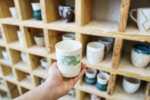 A group of pottery made by hand in the pottery workshop, pottery making