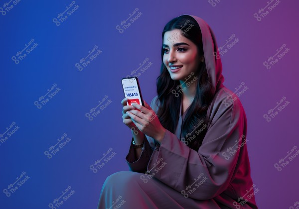 A portrait of a woman wearing a traditional abaya, likely from the Gulf region. She is smiling and holding a smartphone displaying a special code (VISA10). The background features blue and purple gradients, creating a modern atmosphere in the image.