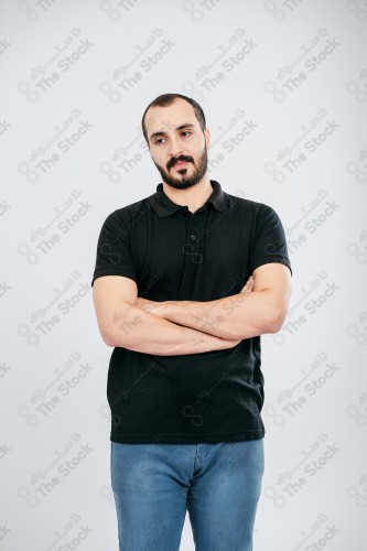 Portrait of a Saudi man on a white background making hand gestures while smiling, souvenir photos, documenting a happy moment