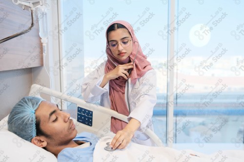 A Saudi female doctor wears a medical uniform and is examining and applying a nutrient solution, medicine and health care