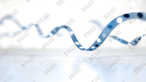 A long, wavy blue ribbon with a white background, adorned with white and black dots of various sizes, suspended in the air in a curved shape.