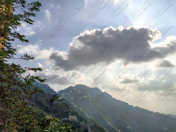 A giant cloud obscures the sun among the charming nature in Faifa Governorate in the Jizan region, south of the .Kingdom of Saudi Arabia