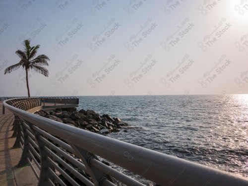 A snapshot of the Jeddah waterfront, showing a clear sky during the day with the sea.