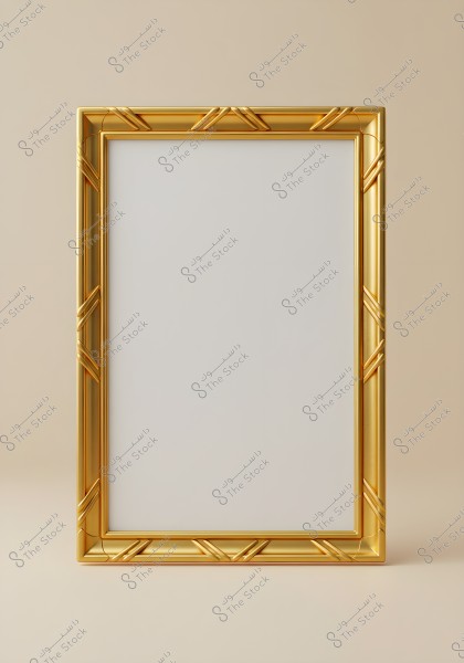 A rectangular empty gold picture frame on a light beige background. The frame has geometric decorations on the edges, adding a luxurious and elegant touch.