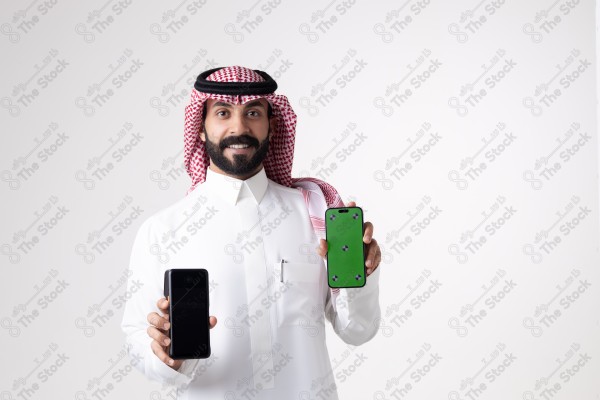 Portrait of a Saudi man holding an ATM and a phone and making different expressions