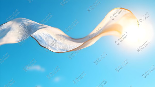 An image shows a piece of translucent fabric fluttering in the air against a sunny blue sky. The fabric is backlit by the sun, creating a shiny and beautiful effect.