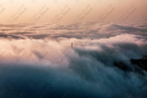 A snapshot showing the Black Mountain in the Jazan region in the south of the Kingdom of Saudi Arabia, an electrifying pillar among the clouds, historical and tourist landmarks, mountainous heights, Jazan mountains, mountainous nature in Jazan