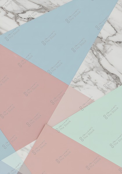 An abstract image featuring geometric shapes in pastel colors like blue, pink, and light green, overlapping on a surface of white marble with dark gray veins. The design highlights the contrast between the soft colors and the luxurious look of the marble.