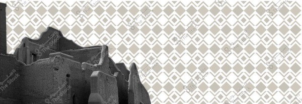 An image of an old mud wall reflecting traditional architectural style, shown in gray against a geometric patterned background composed of diamond shapes in beige and white. The geometric designs are reminiscent of traditional motifs found in Arabic art.