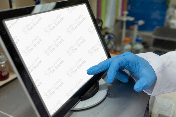 A shot of a female doctor using the device to fill out data.