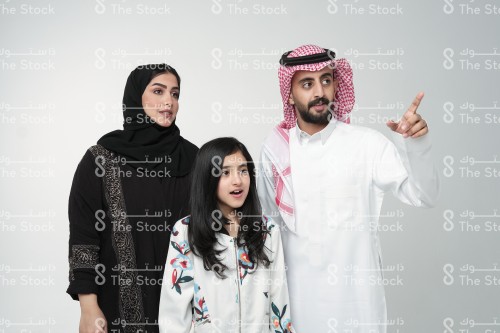 Saudi family making gestures