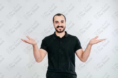 Portrait of a Saudi man on a white background making hand gestures while smiling, souvenir photos, documenting a happy moment