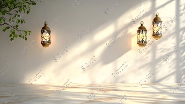 An image featuring three illuminated lanterns with intricate oriental designs hanging from the ceiling against a white wall backdrop with gentle shadows, creating a calm and artistic atmosphere. Green foliage is visible in the top left corner of the image.