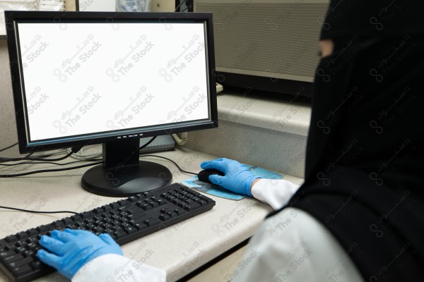 A shot of a female doctor using the device to fill out data.