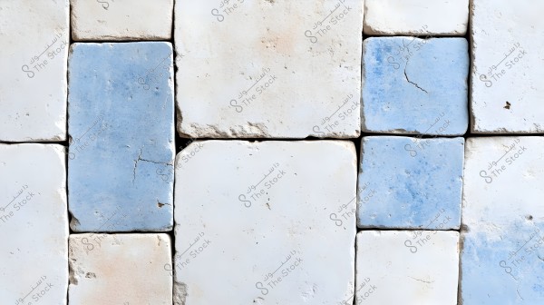 Image of hexagonal tiles in light blue and white colors. Some tiles show signs of cracks and aging, giving the design a vintage look.