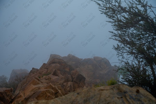 Fog passing over the mountainside from Al Hada, Taif, Saudi Arabia, in winter