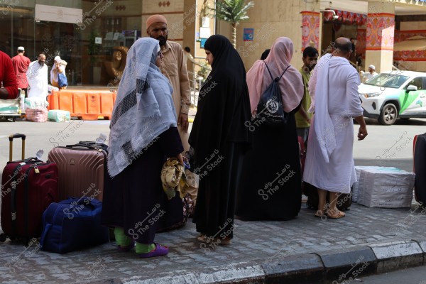 Mecca, Saudi Arabia - March 12 2025: people buying products from market shop in Mecca close to Masjid al-Haram, pilgrims umrah shopping in Makkah