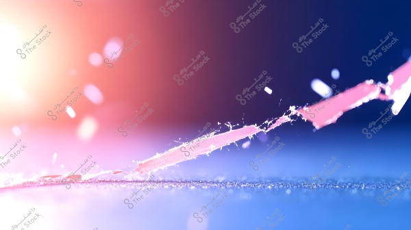 A close-up image of a delicate torn plastic strip on a shimmering blue surface. The background features a gradient light effect from warm colors like orange and pink to blue, with scattered particles conveying movement or disintegration.