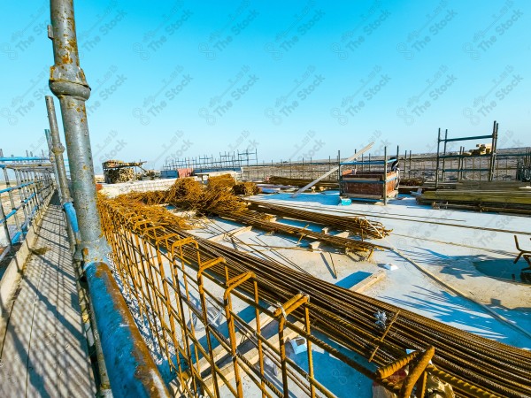 A construction site with a large building in the background. multi-storey building. A construction site with scaffolding and a large building in the background.