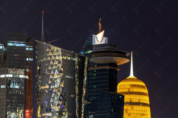 A snapshot of the towers and skyscrapers overlooking the Arabian Gulf in the Qatar region, Doha tourist attractions, tourism in Qatar, Qatar Towers, a tourist waterfront in the State of Qatar.