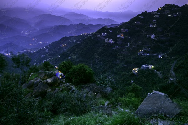 A snapshot of a series of mountains and green areas in Fifa, southern Saudi Arabia, houses on mountain heights, nature in Saudi Arabia