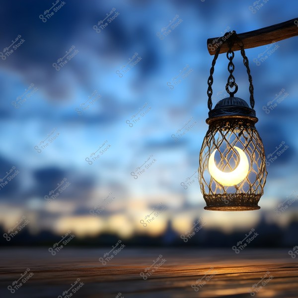 A sunset scene featuring a metallic lantern shaped like a crescent moon, glowing with soft light. The lantern hangs from a wooden beam, with a backdrop of a deep blue sky accented with gradients of yellow and orange on the horizon, evoking a sense of calm and serenity.