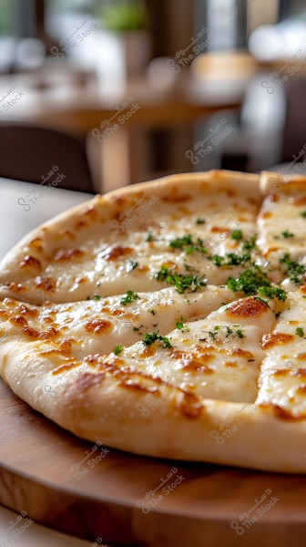 An image of a cheesy pizza on a wooden board, with the pizza cut into triangular slices, topped with a golden layer of melted cheese and sprinkled with parsley. The background is blurred, showing the warm-colored interior of a restaurant or café.