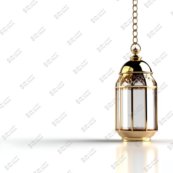 A metallic gold lantern hanging from a chain against a white background. The lantern\'s design features an intricate decorative pattern, making it an artistic piece. The golden shine of the lantern adds a special allure with the light reflecting smoothly off its surface.