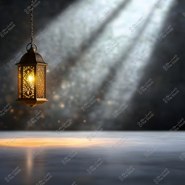 A traditional metallic lantern with an intricate perforated design hangs, casting a warm glow onto a gray surface below. The background is blurred with some light sparkles, with light beams coming from top to bottom, adding a dramatic touch to the image.