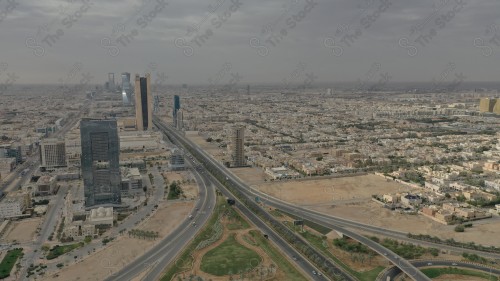 An aerial view of the capital, Riyadh, showing cloudy sky during the day, the towers in the city of Riyadh