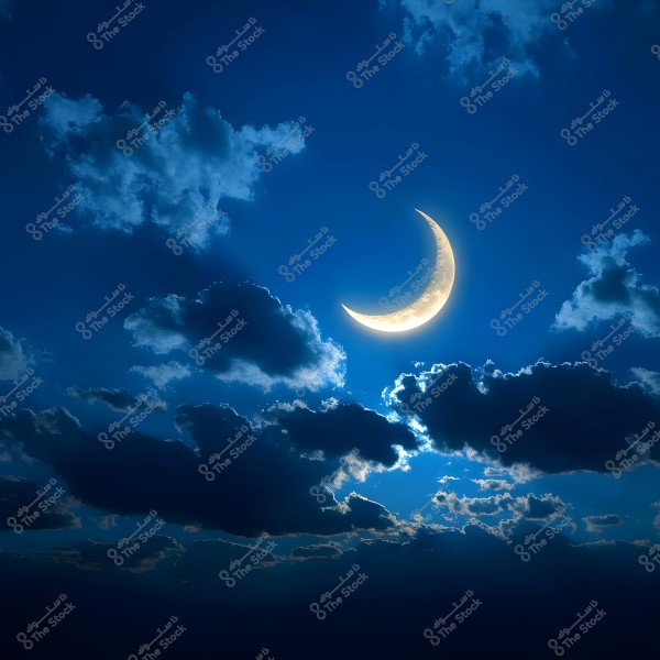 An image of a glowing crescent moon in a blue night sky, surrounded by scattered and soft clouds in varying shades of darkness. The light reflections on the clouds create a calm and enchanting atmosphere.