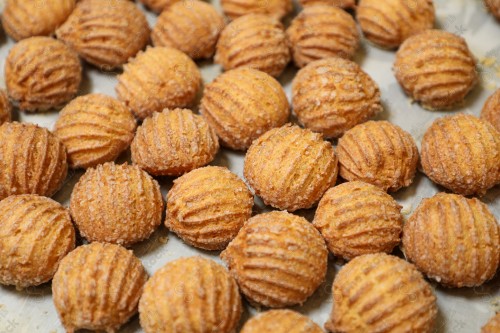 A group of Shami dates on butter paper in an oven tray