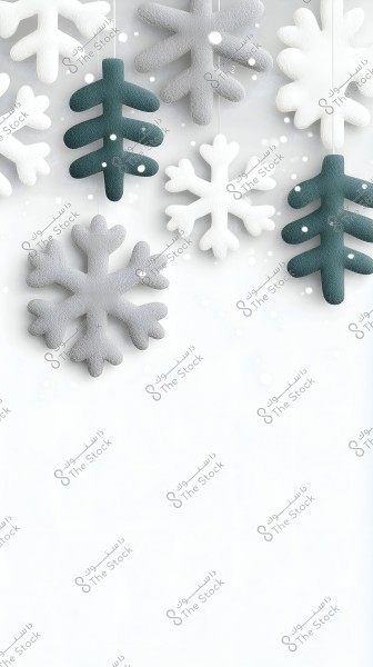 The image features hanging decorations shaped like snowflakes and pine trees made of fabric. The decorations are in white, gray, and dark green colors, set against a white background speckled with snow-like spots.