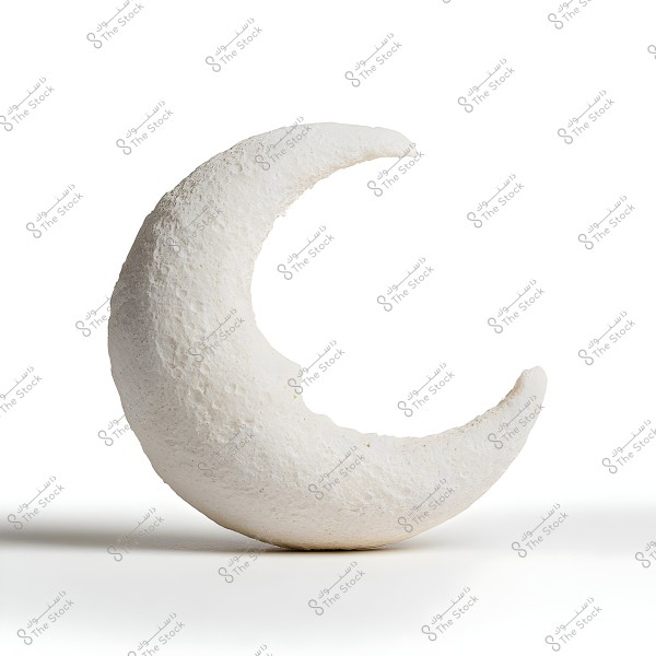 A white stone crescent is centered in the image against a white background. It appears three-dimensional and has a rough texture, making it look like it is made of rock or plaster.