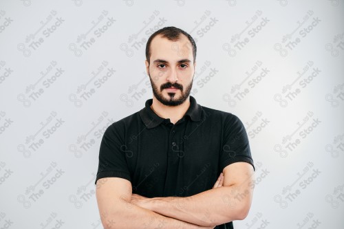 Portrait of a Saudi man on a white background making hand gestures while smiling, souvenir photos, documenting a happy moment