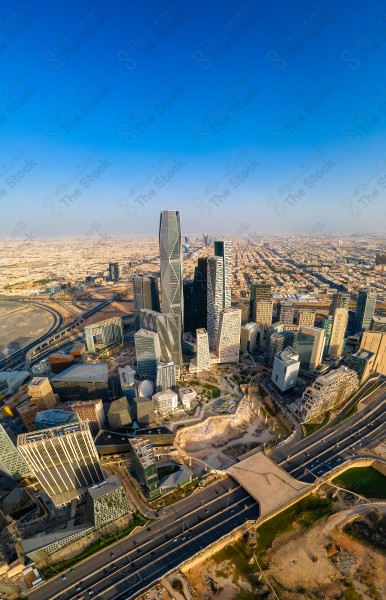 An aerial view of the towers of the financial center in Riyadh during the day, and the sky appears clear. The famous landmarks of Riyadh, towers and skyscrapers, buildings and landmarks