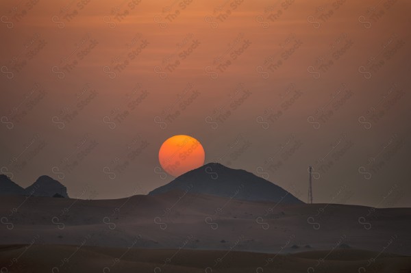 A shot of golden sand dunes in the Riyadh desert, Saudi Arabia, at sunset, showing a clear sky, the Empty Quarter, desert areas,